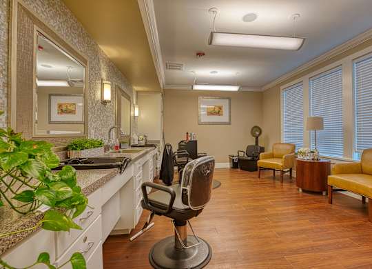 a salon room with a counter with a chair and a mirror at Mariposa at South Broadway, Joshua, 76058