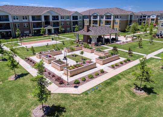 an aerial view of the courtyard at the apartments at Mariposa at South Broadway, TX 76058