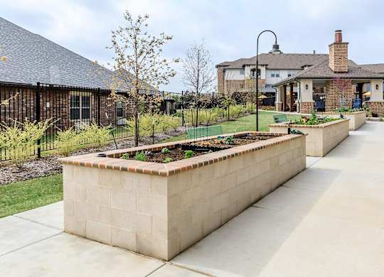 the raised garden in the front yard of a house at Mariposa at Westchester, Grand Prairie Texas