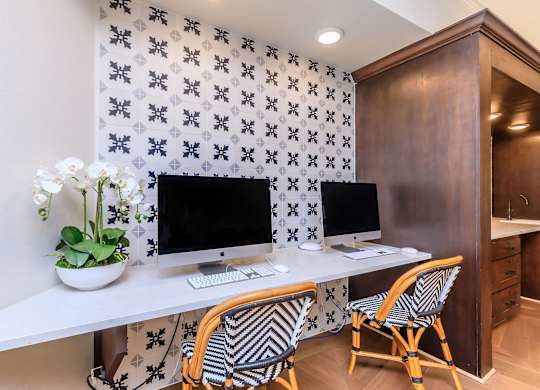 a home office with two computers and two chairs at Mariposa at Westchester, Grand Prairie, 75052