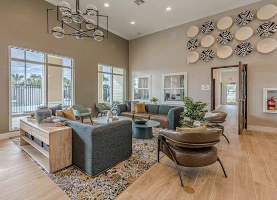 A living room with a grey couch and a wooden coffee table.