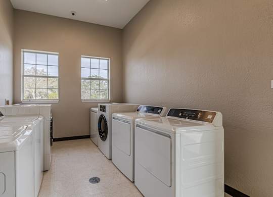 A laundry room with a washer and dryer in it.