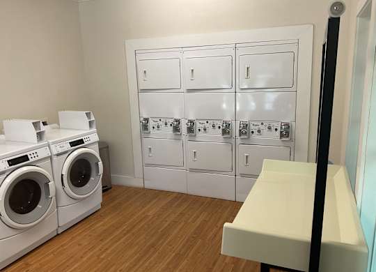a washer and dryer in a laundry room with white appliances