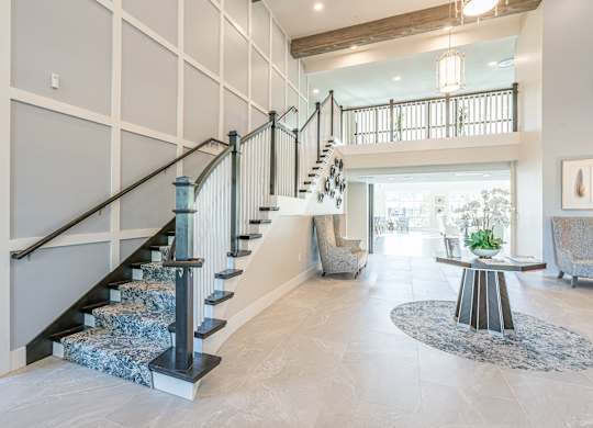 Living room and stairs at Sandpiper Glen 62+ Apartments, Orlando, Florida