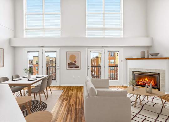 A modern living room with a fireplace and a dining table.