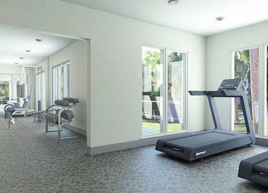 A spacious gym with treadmills and exercise equipment.