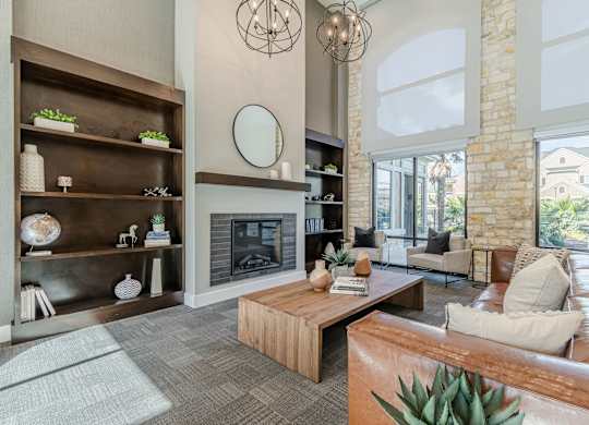 A modern living room with a fireplace and a large mirror on the wall.