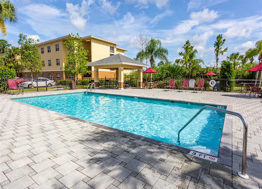A swimming pool with a 3 feet depth sign. at Heron Pond 55+ Apartments, Lehigh Acres, 33972
