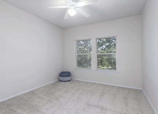 a white room with two windows and a ceiling fan at Mariposa at Bay Colony, Dickinson, TX 77539