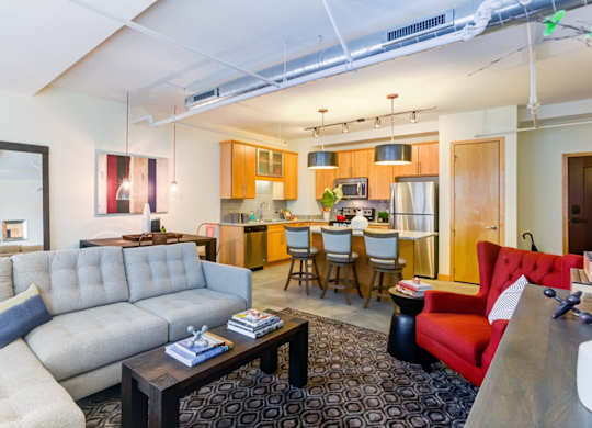 Living room and kitchen area at Arcade Apartments, Missouri, 63101
