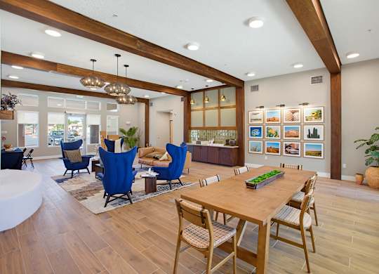 A modern dining room with a wooden table and chairs.