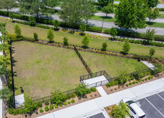 aerial view of dog park at Osprey Park 62+ Apartments, Florida, 34758