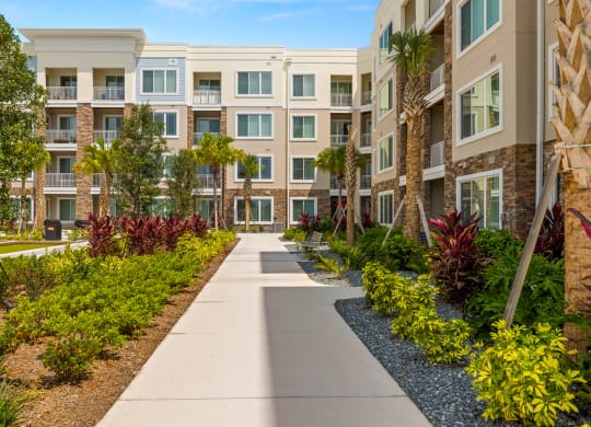 Exterior Walking Path at Osprey Park 62+ Apartments, Kissimmee, FL, 34758