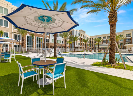 Pool and Lounge Tables at Osprey Park 62+ Apartments, Kissimmee, FL, 34758