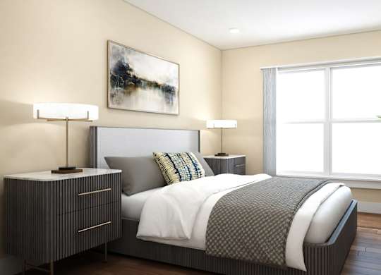 A bedroom with a large bed, a nightstand, and a painting on the wall.