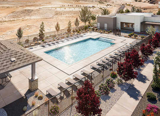 A pool surrounded by trees and a building in the background.