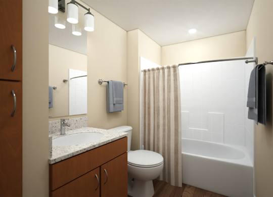 Bathroom with wood vanity and white fixtures at Turquoise Trail Apartments, Santa Fe