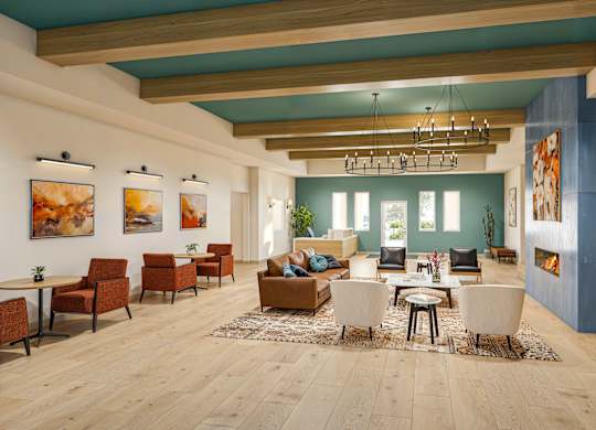 Spacious resident lounge with wood beam ceiling at Vivir at Ballpark Village Apartments, Goodyear, AZ