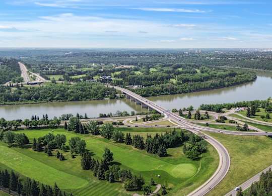 A highway interchange with a river running through it.