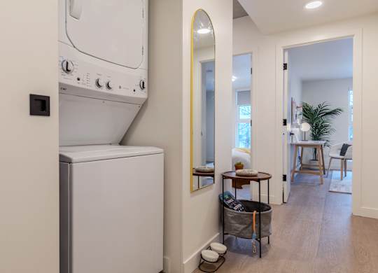 A white oven and microwave in a modern kitchen.