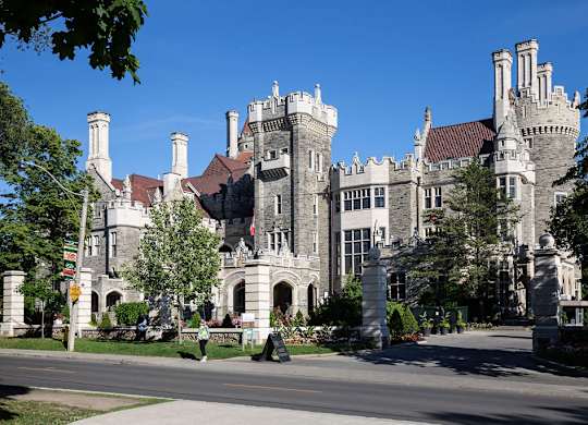 A castle-like building with a red roof and white walls.