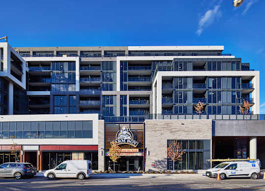 A large building with a parking lot in front of it.