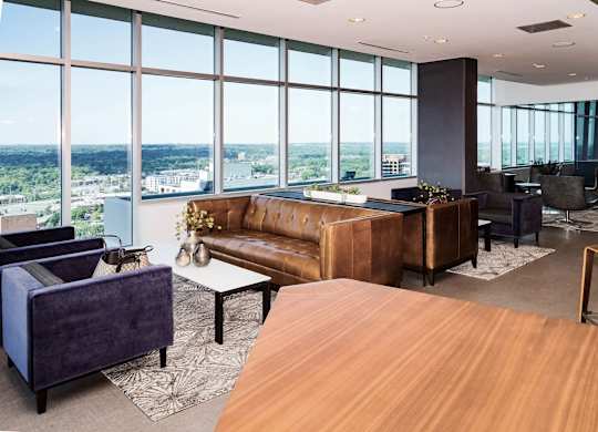 A modern living room with a view of the city.