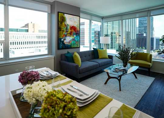 A modern dining room with a view of the city.