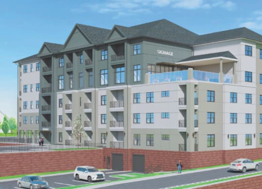 A rendering of a multi-story building with a mix of beige and dark grey exterior.
