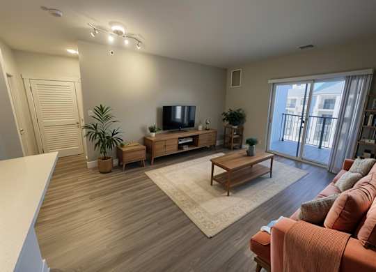 A living room with a television, a couch, and a coffee table.