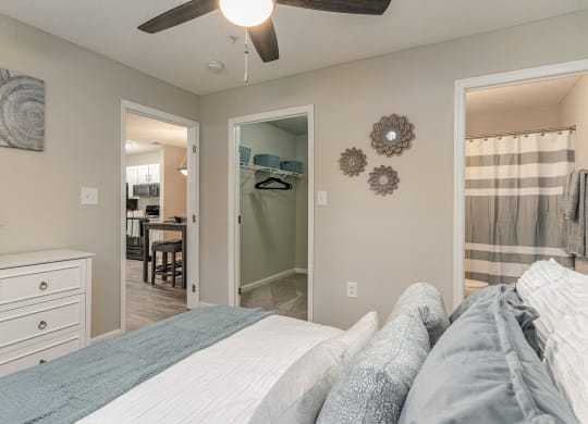 a bedroom with a bed and a closet with a mirror at Litchfield Oaks Apartments, Pawleys Island, SC