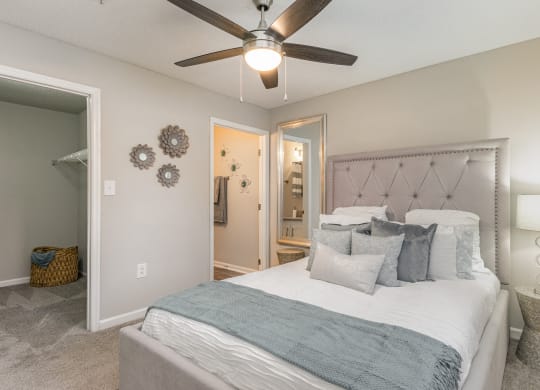 a bedroom with a bed and a ceiling fan at Litchfield Oaks Apartments, Pawleys Island, 29585