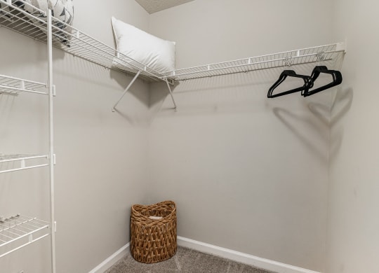 the walk in closet has plenty of shelves and hooks for clothes at Litchfield Oaks Apartments, Pawleys Island, 29585