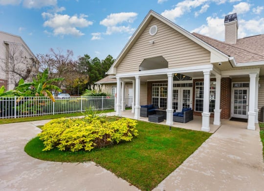 the front yard of a house with a yard and a patio at Litchfield Oaks Apartments, Pawleys Island