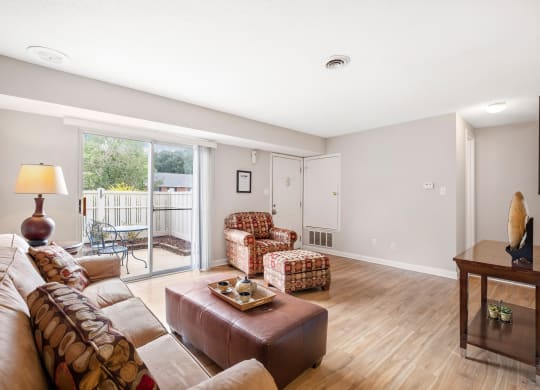 a living room with a couch and two chairs