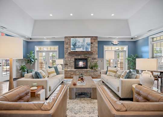 A living room with two couches and a fireplace.