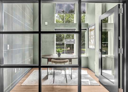 A glass door with a sign that says