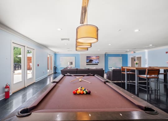 a pool table with a ping pong paddle in the middle of it