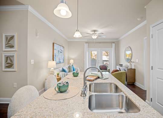 A kitchen with a sink and a counter.