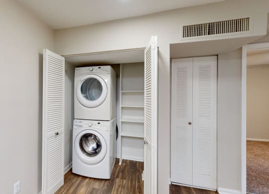 a washer and dryer in a small laundry room