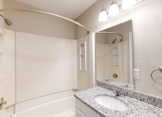 a bathroom with a sink and a bathtub