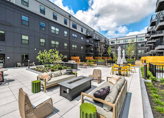 A patio area with furniture and a waterfall feature.
