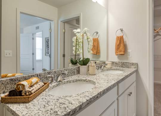 A bathroom with a marble countertop and double sinks at The Mark Townhomes Apartments, Harrisonburg, VA, 22801