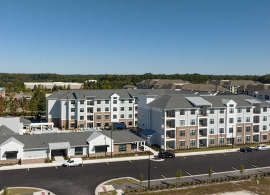 an aerial view of an apartment building in a city