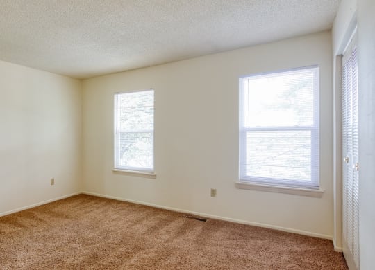 Bedroom with two large windows at The Everett  Apartments in Roanoke, VA 24018