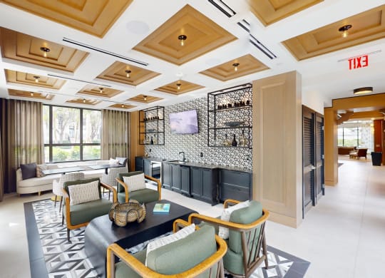 a lobby of a hotel with couches and chairs