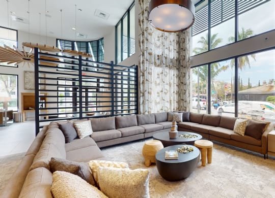 a living room with a large stone pillar and a large couch