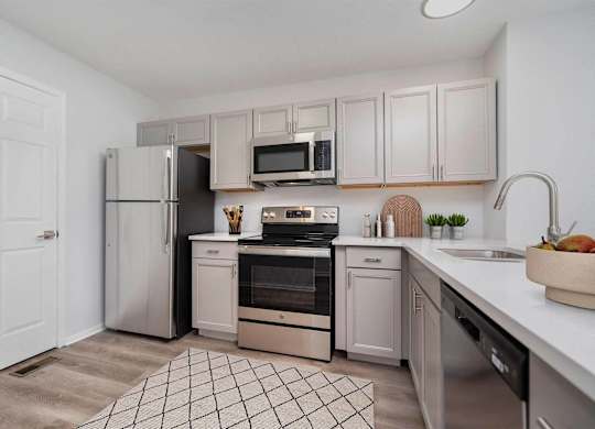 Kitchen with white cabinets at Camden Place Apartments, Dublin, OH