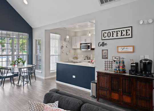 A kitchen with a coffee sign on the wall at Litchfield Oaks Apartments in Pawleys Island, SC, 29585