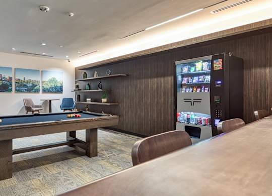 A room with a pool table, a vending machine, and a bar at Residences at Richmond Trust in Virginia, 23219